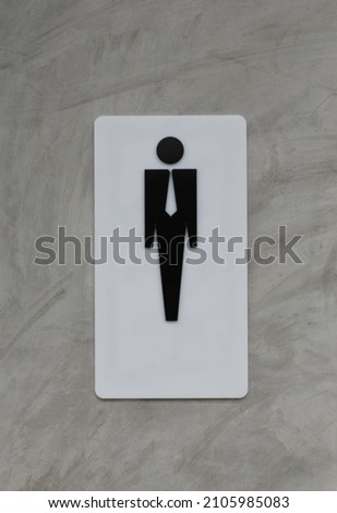 Male restroom sign on grey vintage cement wall background for design in your work.