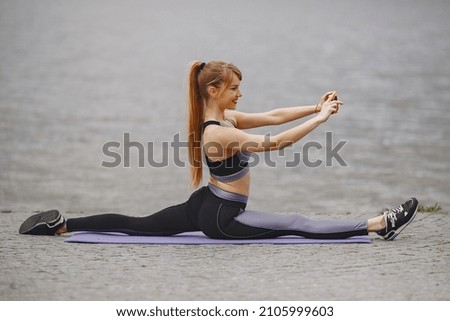 Sports girl training in a summer park