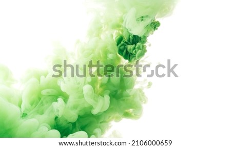 Diagonal splash of green paint in water against white background.