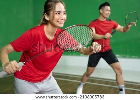 Mixed doubles badminton player with stance position ready to play Royalty-Free Stock Photo #2106005783