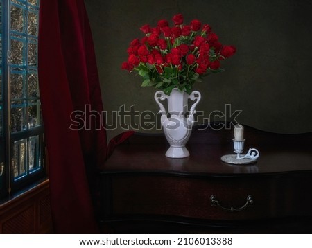 Still life with a luxurious bouquet of red roses 