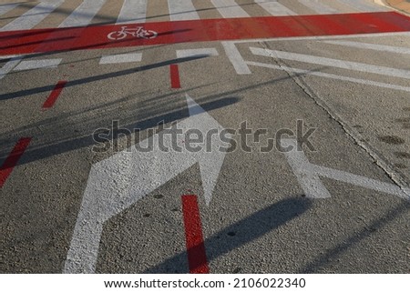 Arrows painted on a tar road: right, Alicante province, Costa Blanca, Spain