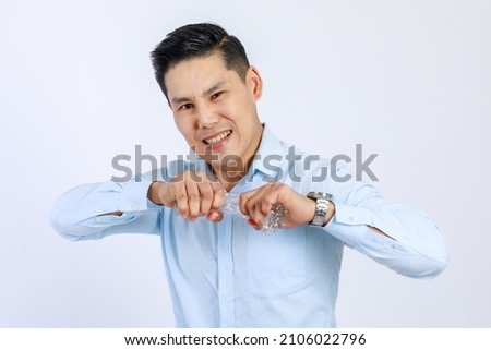 Photo of business Asian man young boss campaign says no plastic, reducing plastic, reducing global warming, studio light shot isolated on white background. Environment concept