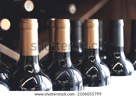 Wine bottles with blank labels on the counter of a liquor store. Wine background. Selected focus