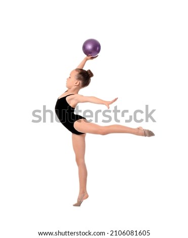 Little girl doing gymnastics with ball on white background