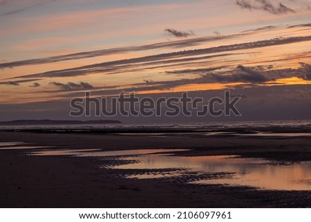 Dramatic sunset on the beach with beautiful colorful sky, Cap Blanc Nez, opal coast of France, Europe. High quality photo