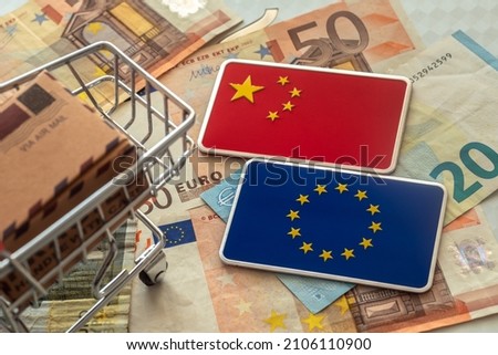 Europe and Chinese Trade Feuding. Packing and Shipping Boxes with a National flags of China, an European Union Royalty-Free Stock Photo #2106110900