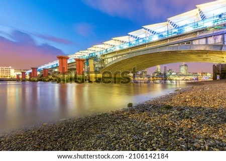 under blackfriars bridge by night river thames reflections city