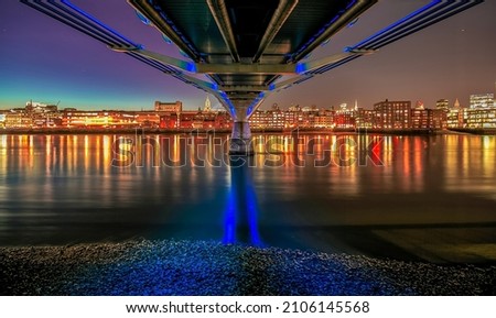 millenium bridge london by night river thames reflections