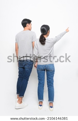 Full body young couple in  standing together in studio
rear view

 Royalty-Free Stock Photo #2106146381