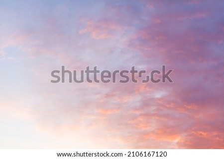 Colorful pink clouds in the sky at sunrise or sunset. Natural natural background.