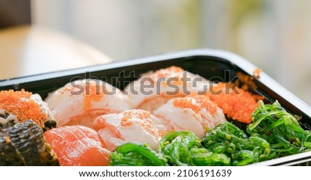 Japanese food. Philadelphia roll sushi with salmon, prawn, avocado, cream cheese. Sushi menu,  looks delicious.