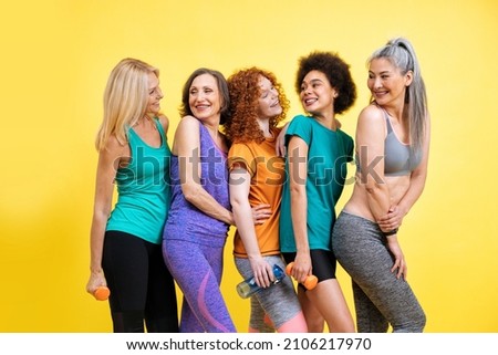 Group of women with different body, age, and ethnicity making sport. Female models wearing sport outfits having fun at the gym. Concept about body positivity, self acceptance and lifestyle Royalty-Free Stock Photo #2106217970