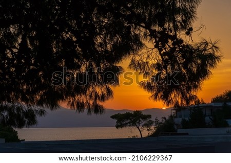 A bright colorful sunset in Greece, on the Peloponnese beach.