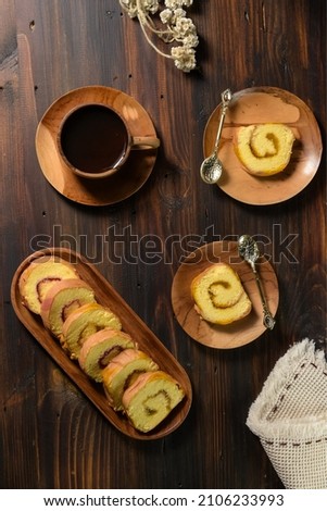Sponge rolls are sponge cakes that are baked in a shallow pan, filled with jam or butter cream and then rolled. Sponge rolls are often known as jam rolls, or jelly rolls. Served on a plate