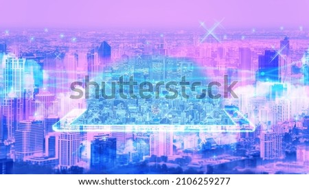 Futuristic hologram city in cyber punk theme color. Metaverse technology growth in future data network and business concept. Digital game connect. Royalty-Free Stock Photo #2106259277