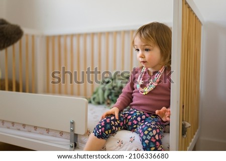 A Little girl playing in the bedroom at home