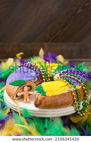 Mardi Gras King Cake on Wood Background