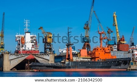technical vessel on the background of shipyards. ship repairs. floating repair dock. background picture.