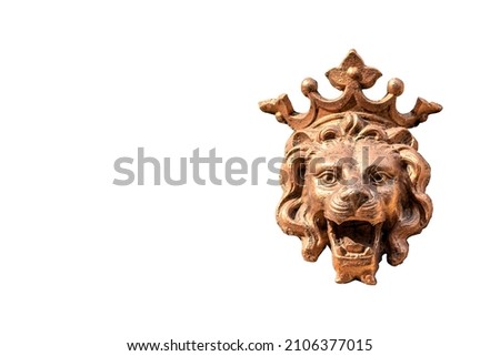 Sculpture of shiny gold lion head lion on white background.