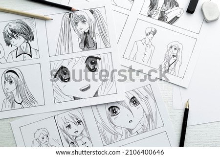 Drawings of anime characters on the desktop. Comic book storyboard. Manga style. Royalty-Free Stock Photo #2106400646