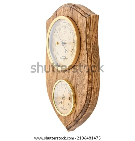 Vintage wooden clock with barometer and Old marine style thermometer on a white background. Wall decor for the interior. Royalty-Free Stock Photo #2106481475