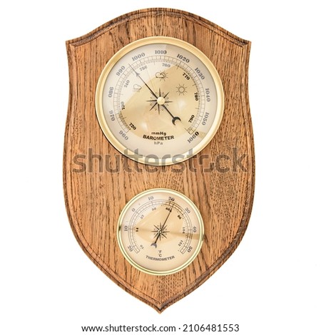Vintage wooden clock with barometer and Old marine style thermometer on a white background. Wall decor for the interior. Royalty-Free Stock Photo #2106481553