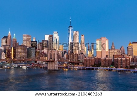 Manhattan, New York City, New York, USA. Sunrise view of Manhattan and the Brooklyn Bridge.