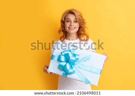 amazed happy redhead woman with gift box. anniversary