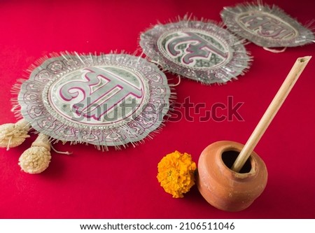 bengali hindu festival saraswati puja and vasant panchami. symbolic concept with copy space.puja items for offering to the goddess of education. bengali words translate to "mother, give us knowledge"