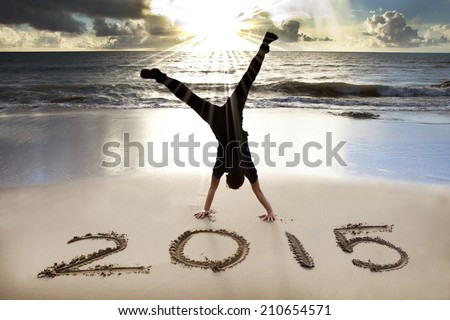 happy new year 2015 on the beach with sunrise Royalty-Free Stock Photo #210654571