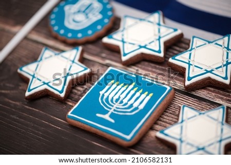 Delicious festive Hanukkah cookies for celebrating on a wooden background at home. Closeup.