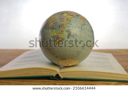 globe of the globe on the open book concept of knowledge education. High quality photo