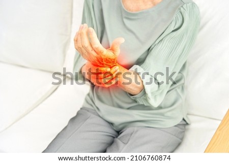 Asian senior woman having the joint pain, no face