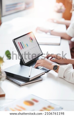 Business people team working at office with tablet and document, doing planning analyzing the financial report, business plan investment, finance analysis concept. Economic business discussions. Royalty-Free Stock Photo #2106761198