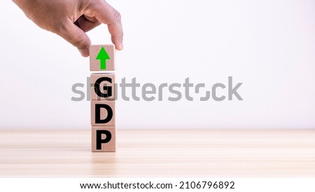 Concept of economic growth with higher GDP in cubic timber. Savings and Investments for Business Ideas digital economy and economic exchange.