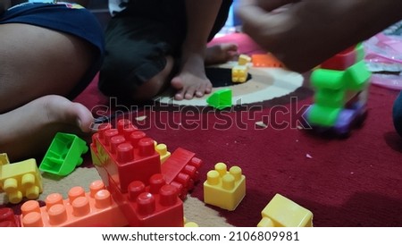 children playing colorful puzzle games