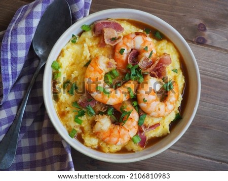 Southern style shrimp and grits Royalty-Free Stock Photo #2106810983