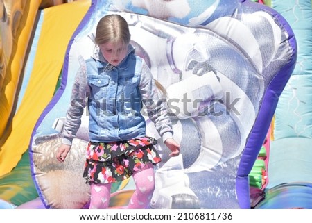 children play on the inflatable castle,
