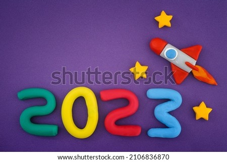 The New Year 2023. The space rocket and Numbers are made out of play clay (plasticine).