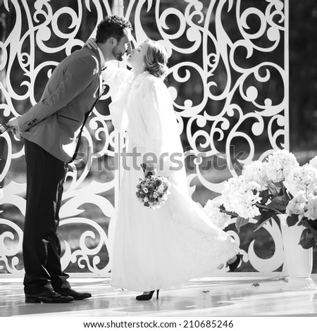 Black and white picture of happy wedding couple together. Groom and bride.