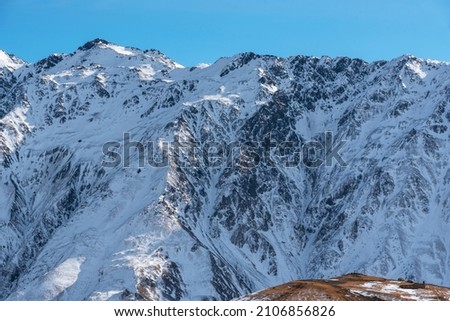 Beautiful winter moointains landscape. High snow covered mountains. Georgia,  Kazbegi.