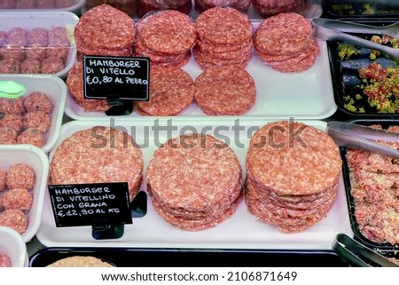 Meat for hamburgers for sale in an Italian butcher's shop. In the signs written in Italian "veal hamburger"