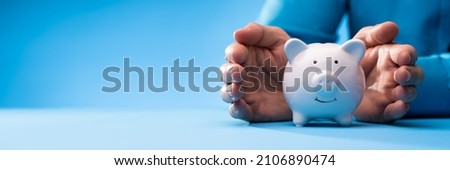 Pension And Income Protection. Save Money In Piggybank Insurance Royalty-Free Stock Photo #2106890474