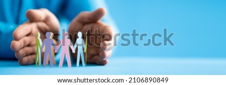 Inclusion And Diversity. Hand Protecting Inclusive Equal Pawns Royalty-Free Stock Photo #2106890849