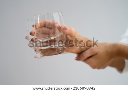 Person Hand With Dystonia. Degenerative Aging Movement Royalty-Free Stock Photo #2106890942