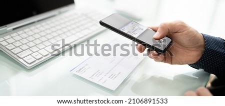 Scanning Remote Deposit Check Document Using Phone. Taking Photo