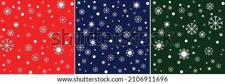 Set of vector seamless patterns with snowflakes. White snow on a red blue and green background.
