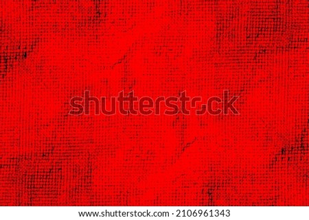 Seamless abstract black grunge texture on saturated red paper for the background