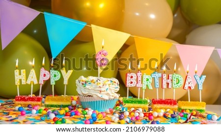 Cream cake with a candle for six years, Happy birthday colorful card for a child of 6 years old, birthday cupcake with candles and birthday decorations
